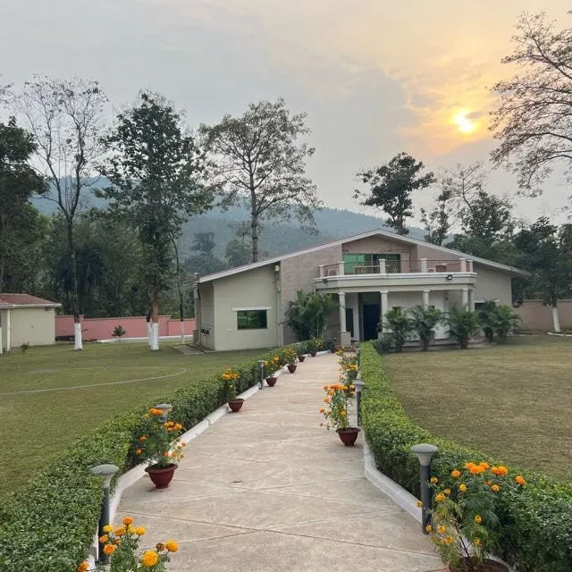 Marigold-lined path leading to the farmhouse at golden hour